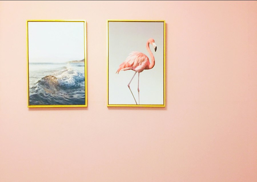Framed wallpaper accent applied to a finished interior wall